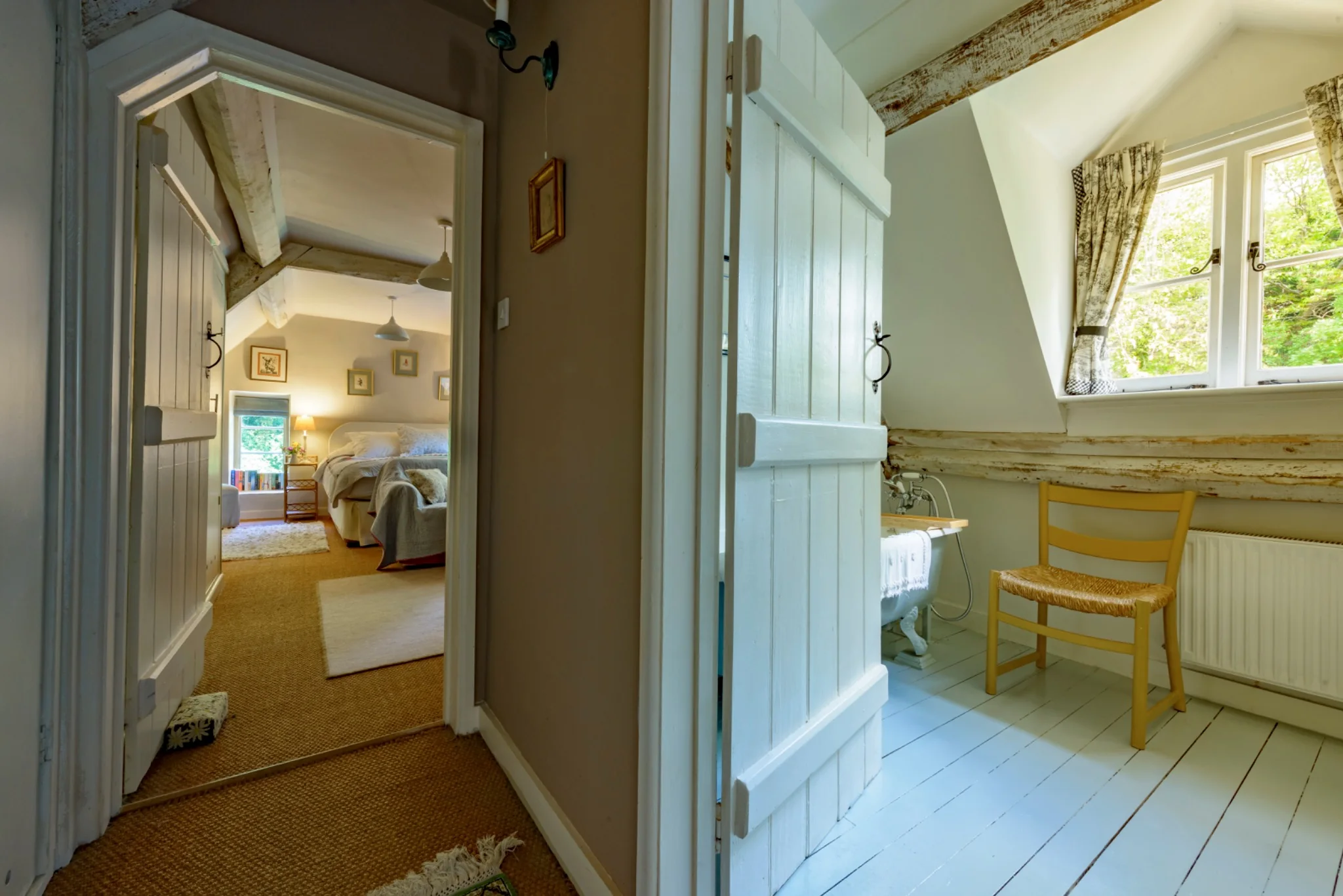 Bedroom two and its private bathroom across the short corridor