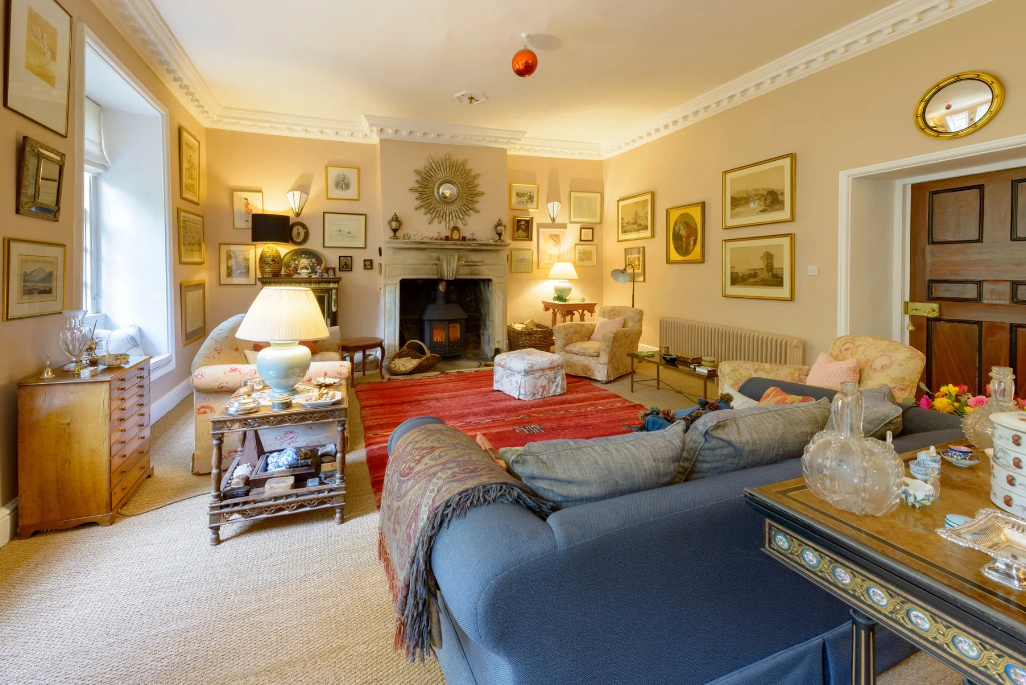 The lit stove in the drawing room fireplace
