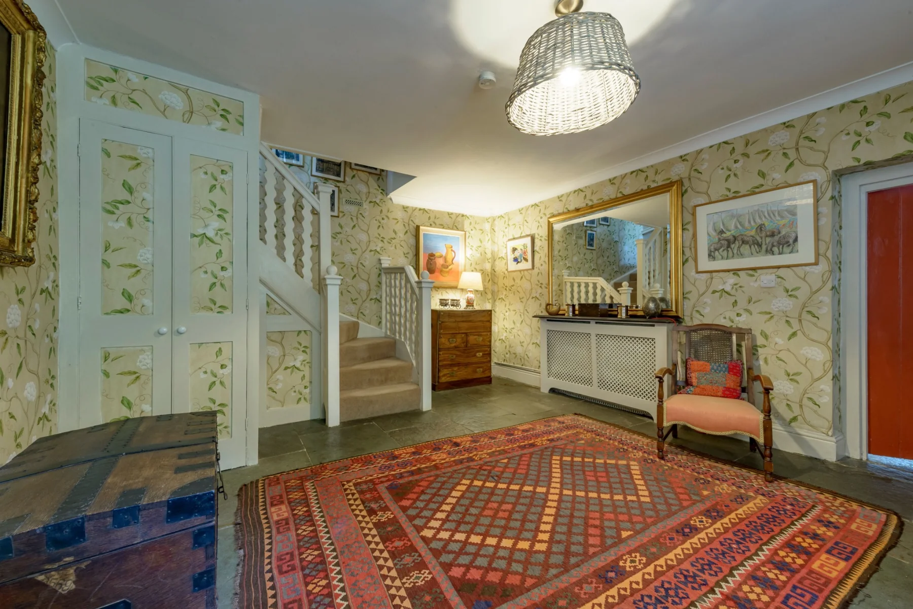 The hall and staircase leading towards the bedrooms
